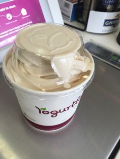 yogurt sitting on top of a metal counter