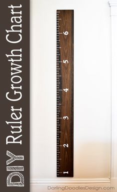 a wooden ruler with the words first growth on it and an image of a wall in the background