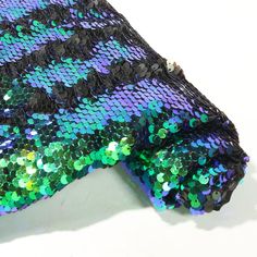 a close up of a tie with sequins on it