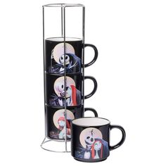 three coffee mugs are stacked on top of each other