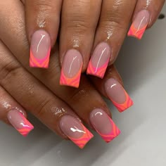 The glowing electric at the end of these nails brings a charge on them. The contrast is striking with neon pink and orange emitting a glow reminiscent to those of the summer’s most brilliant sunsets.   Photo credit by: @sandynailsbeautysalon Orange N Pink Nails, Nails For Lanzarote, Orange And Pink Nails Square, Summer Holiday Nail Inspiration, Orange Pink French Nails, French Tip And Design Nails, Patterned Nail Designs, Summer Nails Square Bright, End Summer Nails