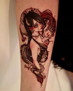 a woman with a dragon tattoo on her arm is holding onto a snake's tail