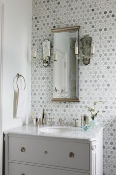 a bathroom with two sinks and a mirror