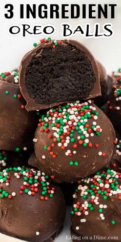 chocolate covered oreo balls stacked on top of each other with sprinkles