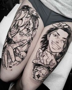 two people with tattoos on their legs sitting next to each other