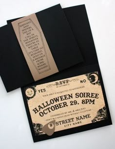 an old fashioned halloween party ticket is laying on top of some black envelopes and paper