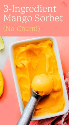 a bowl filled with mango sorbet on top of a pink table