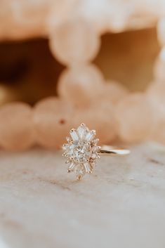 a diamond ring sitting on top of a table