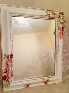 a mirror that has flowers on it