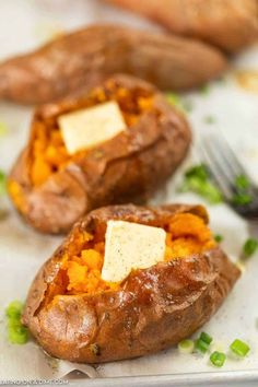 baked sweet potatoes with butter and parmesan cheese on top, ready to be eaten