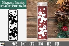 christmas candles with snowmen and stars are on the table next to pine cones, holly branches