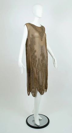 Taupe Crêpe Scallop Hem Flapper Dress with Silver-Plate Glass Beads – M, 1920s For Sale at 1stDibs | flapper jurk, silver flapper dress, taupe beaded dress Silver Flapper Dress, 1920s Dress Vintage, 1920s Evening Gowns, 1960s Wedding Dresses, Flapper Dress 1920s, 1920s Evening Dress, Early 20th Century Fashion, 1950s Wedding Dress, Beaded Flapper Dress