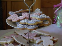 there are many cookies on the plate and one is decorated with icing or sugar