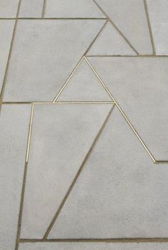 a white tile floor with lines and shapes on the top one is diagonally arranged