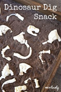 the dinosaur dig snack is made with chocolate and marshmallows, then covered in white frosting