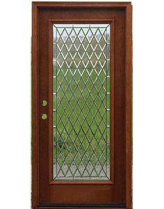 a wooden door with stained glass on the side and green grass in the back ground