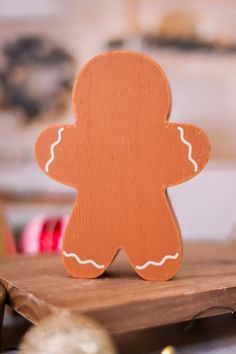 a wooden cutout of a ginger on a table