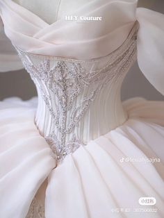 the back of a white wedding dress on display