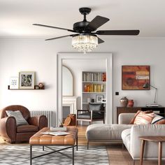 a living room filled with furniture and a ceiling fan