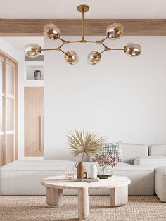 a living room with a couch, coffee table and lamps on the ceiling above it