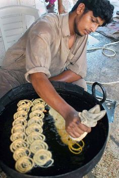 a man is cooking some kind of food