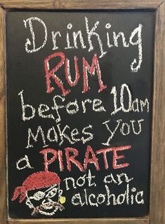 a chalk board with writing on it that says drinking rum before 10am makes you a pirate not an alcoholic