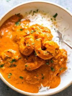 a bowl filled with rice and shrimp curry