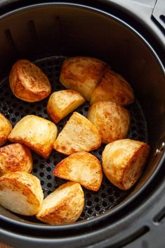 cooked potatoes in an air fryer basket