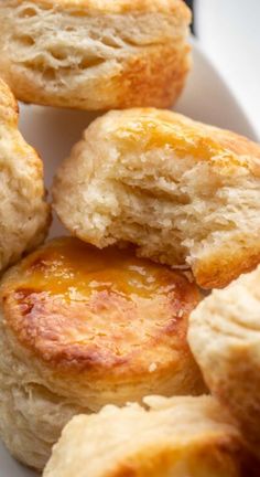 some biscuits are sitting on a white plate