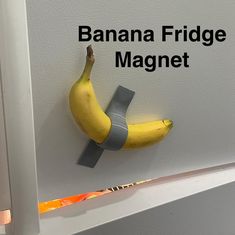 there is a banana on the fridge magnet