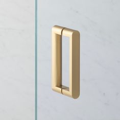 an image of a door handle that is on the side of a glass door with marble background