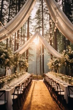 an outdoor wedding setup in the woods