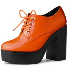 Take your look to a brand new height by stepping out in high platform block heel Booties! These sky-high stunners start with a PU composition and round-toe upper. A lace-up vamp with silver hardware allows you to be easy on. Heel Height: 4 1/2 inches. Please check the size measurement chart before ordering. Weird Shoes, Orange Platform Heels With Round Toe, Platform Heels 70s Ankle Boots, Multicolor High Ankle Platform Boots, Orange Platform Boots, Orange Synthetic Platform Heels, Chunky Heel Ankle Boots, Creative Shoes, Womens Combat Boots