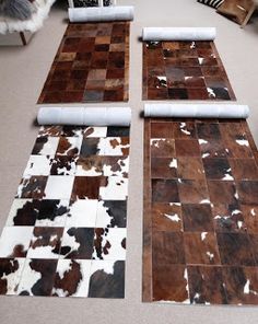 several pieces of cow hide laid out on the floor