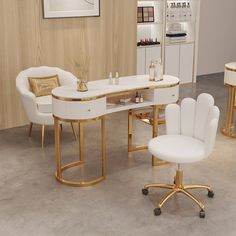 a dining room table and chairs with gold trim around the legs, in white leather