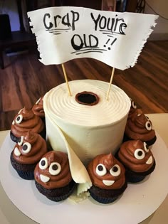 cupcakes with googly eyes and a sign that says crap you're old