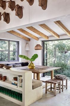 a living room filled with furniture next to a window