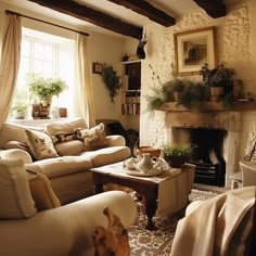 a living room filled with furniture and a fire place