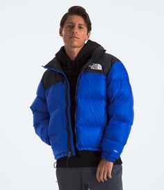 We didn’t just make a puffer. We made the Nuptse. A jacket rooted in the unforgiving nature of mountaineering and immortalized on city streets. Respected for generations, our 1996 Retro Nuptse Jacket retains the confidence and grit to stand alone. With unmistakable oversized baffles, and ultra-warm 700-fill down insulation, it’s been a global symbol for decades. Relaxed but packable. Protective but chill. This is an icon. Men's Men's Insulated & Down. Packable. [North Face, Northface, thenorthfa 1996 Retro Nuptse Jacket, Retro Nuptse Jacket, Nuptse Jacket, North Face Nuptse, Cool Outfits For Men, Vests Mens, Blue Fits, Ripstop Fabric, Performance Outfit