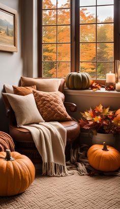 a living room filled with furniture and lots of pumpkins in front of a window