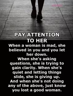 a woman walking down a sidewalk with the words pay attention to her