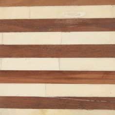 an american flag made out of wood with white and brown strips on the bottom half