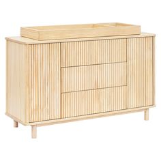 the sideboard is made from wood and has three drawers on one end, and two doors on the other