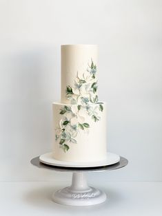 Painted buttercream floral wedding cake Wedding Cakes Simple Two Tier, Easy Wedding Cake Designs, Greenery Cake Wedding, Foliage Wedding Cake, Greenery Wedding Cakes, 3 Tier Wedding Cake Ideas Elegant, Wedding Cake With Frosting Flowers, Plant Wedding Cake, Icing Flowers Wedding Cake