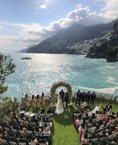 an outdoor wedding ceremony overlooking the ocean