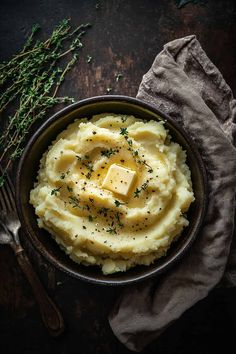 mashed potatoes with butter and herbs in a bowl