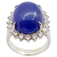 Cabochon Tanzanite with Cubic Zirconia Ring set in Silver Settings Width: 1.7 cm Length: 2.0 cm Ring Size: 52 Total Weight: 6.65 grams *Please note that the silver setting is plated with rhodium to promote shine and help prevent oxidation. However, with the nature of silver, oxidation may occur over time and use. "We first opened doors in 1980 when it was then situated in the vicinity of the Victory Monument; a small and modest storefront with a couple of counters. From its humble beginnings to Cubic Zirconia Rings, Tanzania, Ring Sets, Monument, Cubic Zirconia, Jewelry Rings, Ring Size, Plating, Engagement Rings