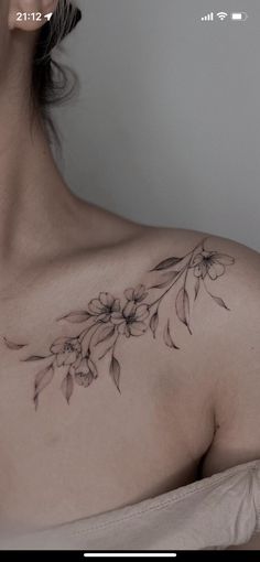 a woman's chest with flowers on it