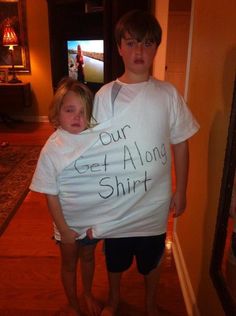 a young boy and girl holding a t - shirt that says our get along shirt