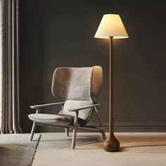 a chair sitting next to a lamp in a room